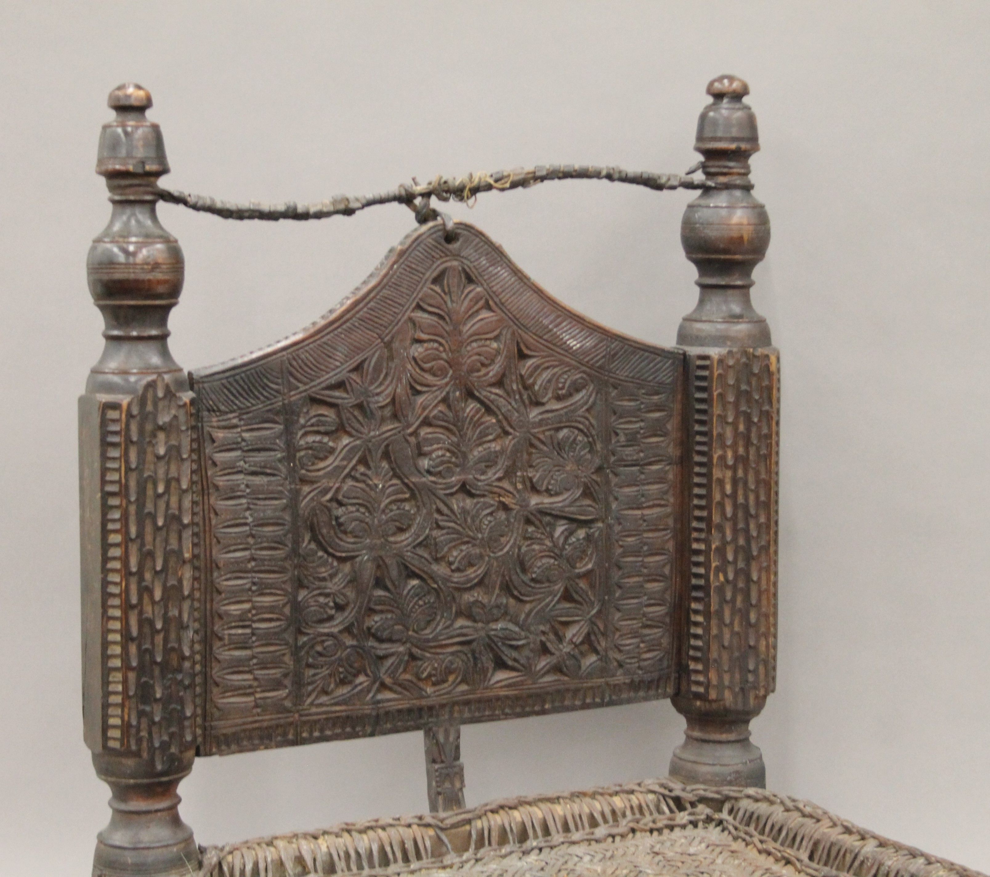 An Indian antique low hardwood chair with reeded seating. 64 cm high. - Image 2 of 5