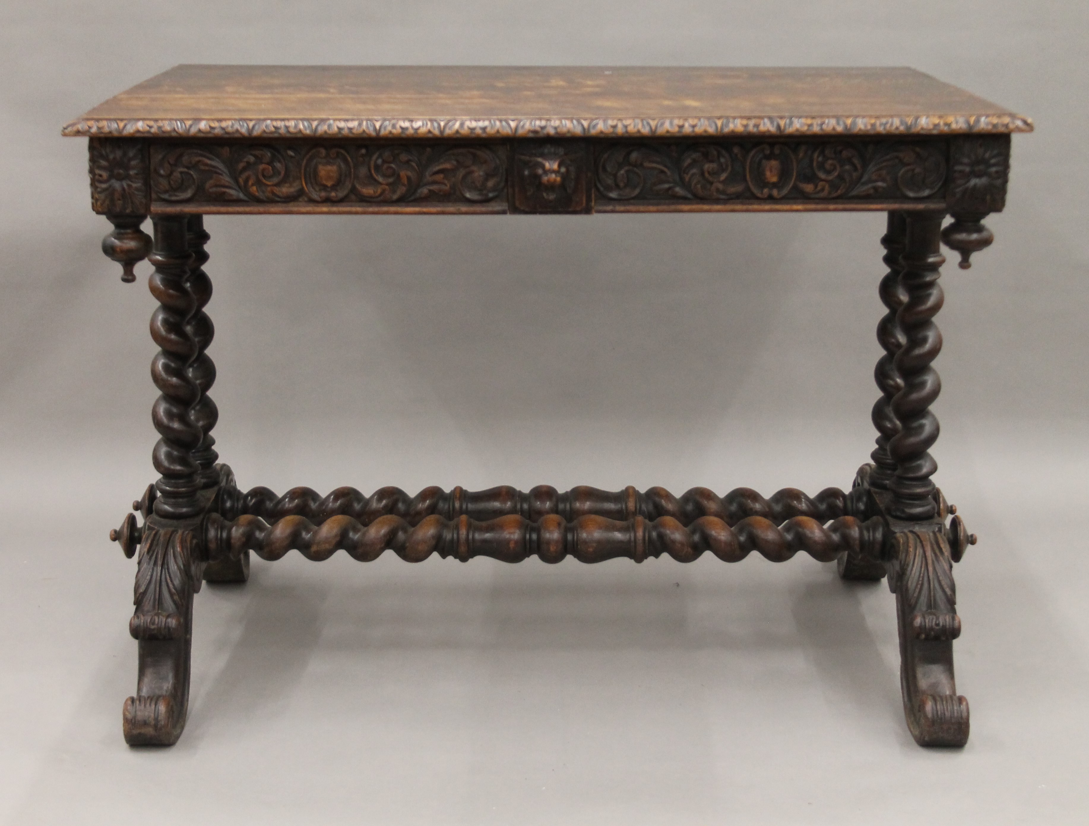 A Victorian carved oak barley twist two drawer writing table. 105 cm long. - Image 2 of 9