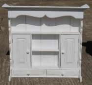 A white painted dresser rack. 116 cm wide.