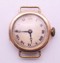 A 9 ct gold cased ladies wristwatch. 2.5 cm wide. 11.3 grammes total weight.
