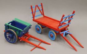 A quantity of wooden toys, including trains, carts, a lorry and a boat. The latter 44 cm long.