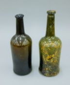 Two 19th century wine bottles. The largest 27 cm high.
