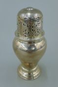 A small silver castor. 10 cm high. 143.6 grammes.