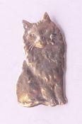 A silver cat brooch. 3 cm high.