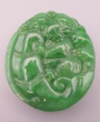 A Chinese carved hardstone pendant, possibly jadite. 4.5 cm high.