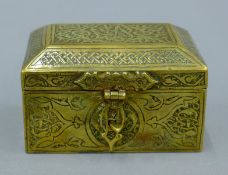 A Persian brass casket. 8 cm wide.