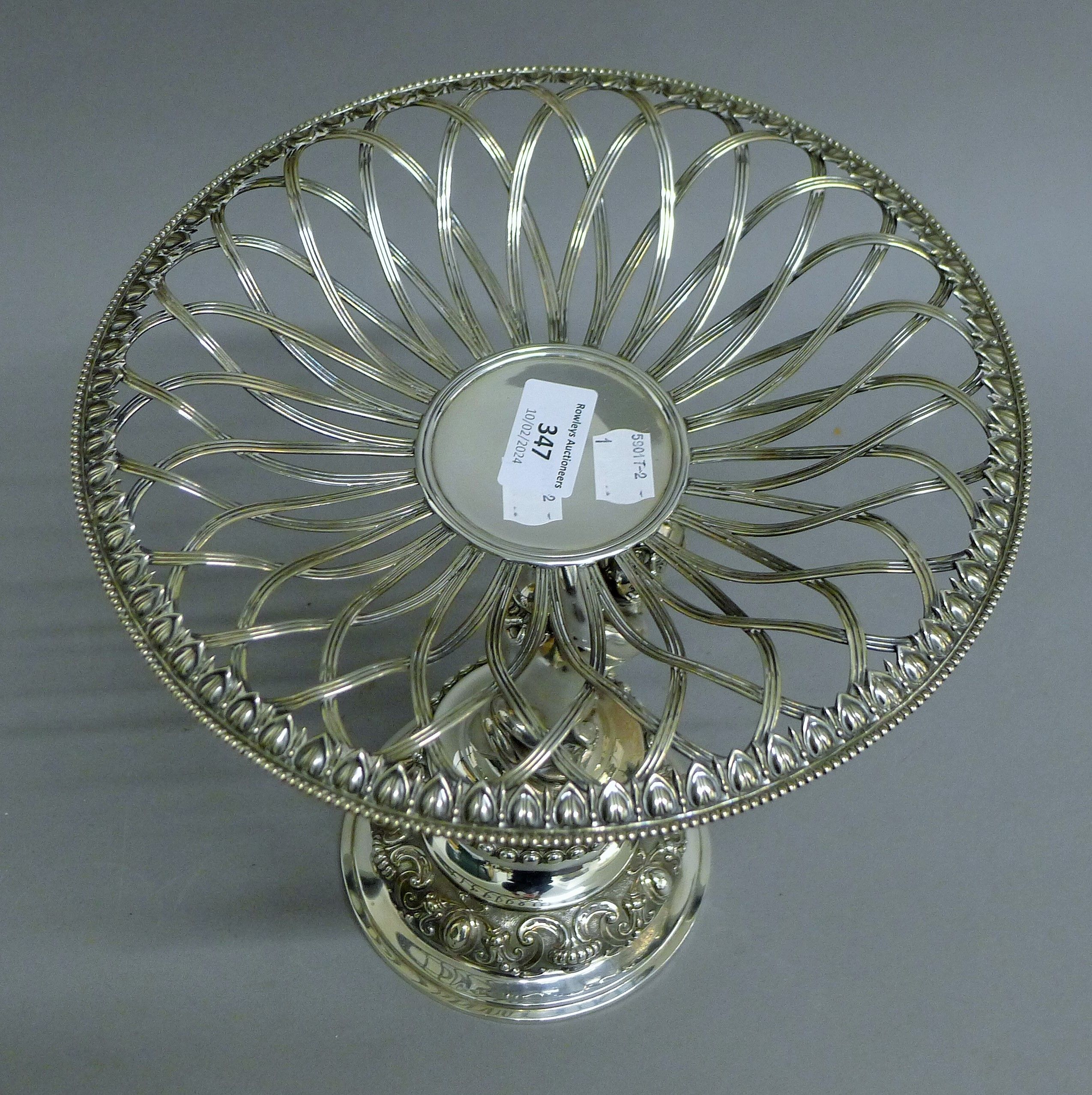 A Victorian silver centrepiece, the stem formed as a putto holding a pierced basket, - Image 8 of 10