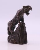 A bronze model of a tiger. 5 cm high.