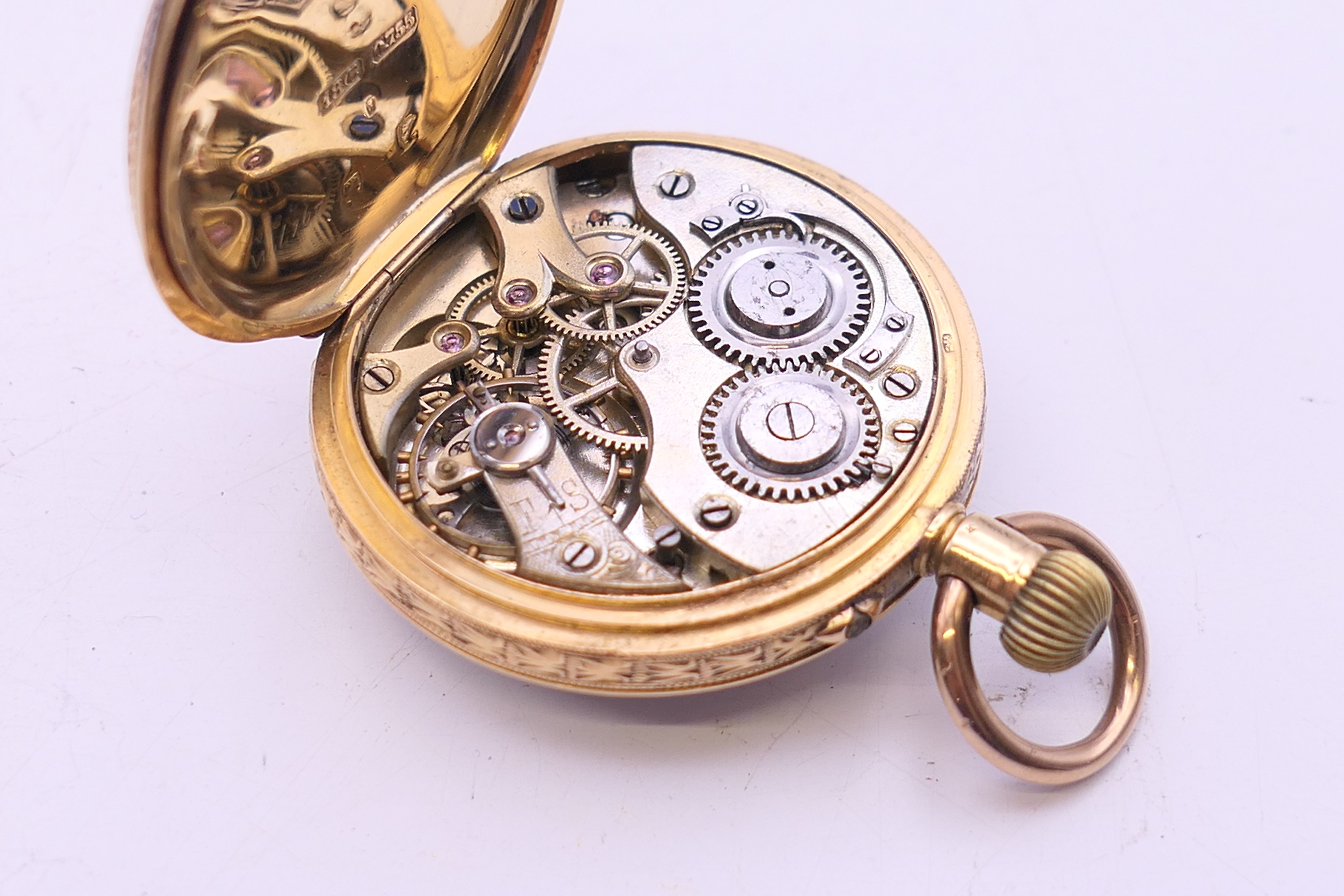 An 18 ct gold cased fob watch. 3.25 cm diameter. 31.7 grammes total weight. - Image 9 of 10
