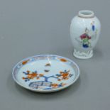 An 18th century Chinese Imari porcelain saucer and an 18th century Chinese porcelain tea caddy