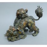 A Chinese double dog-of-fo bronze censer. 21 cm high.