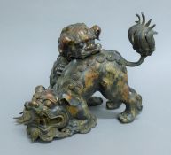 A Chinese double dog-of-fo bronze censer. 21 cm high.