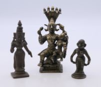 Three antique Indian bronze figures. The largest 9 cm high.