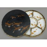 A Japanese porcelain hors d'oeuvres set in lacquered box. 31 cm diameter.