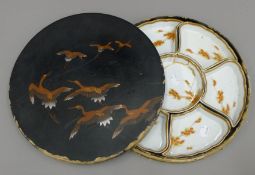 A Japanese porcelain hors d'oeuvres set in lacquered box. 31 cm diameter.