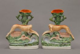 A pair of 19th century Staffordshire pottery coursing figures,