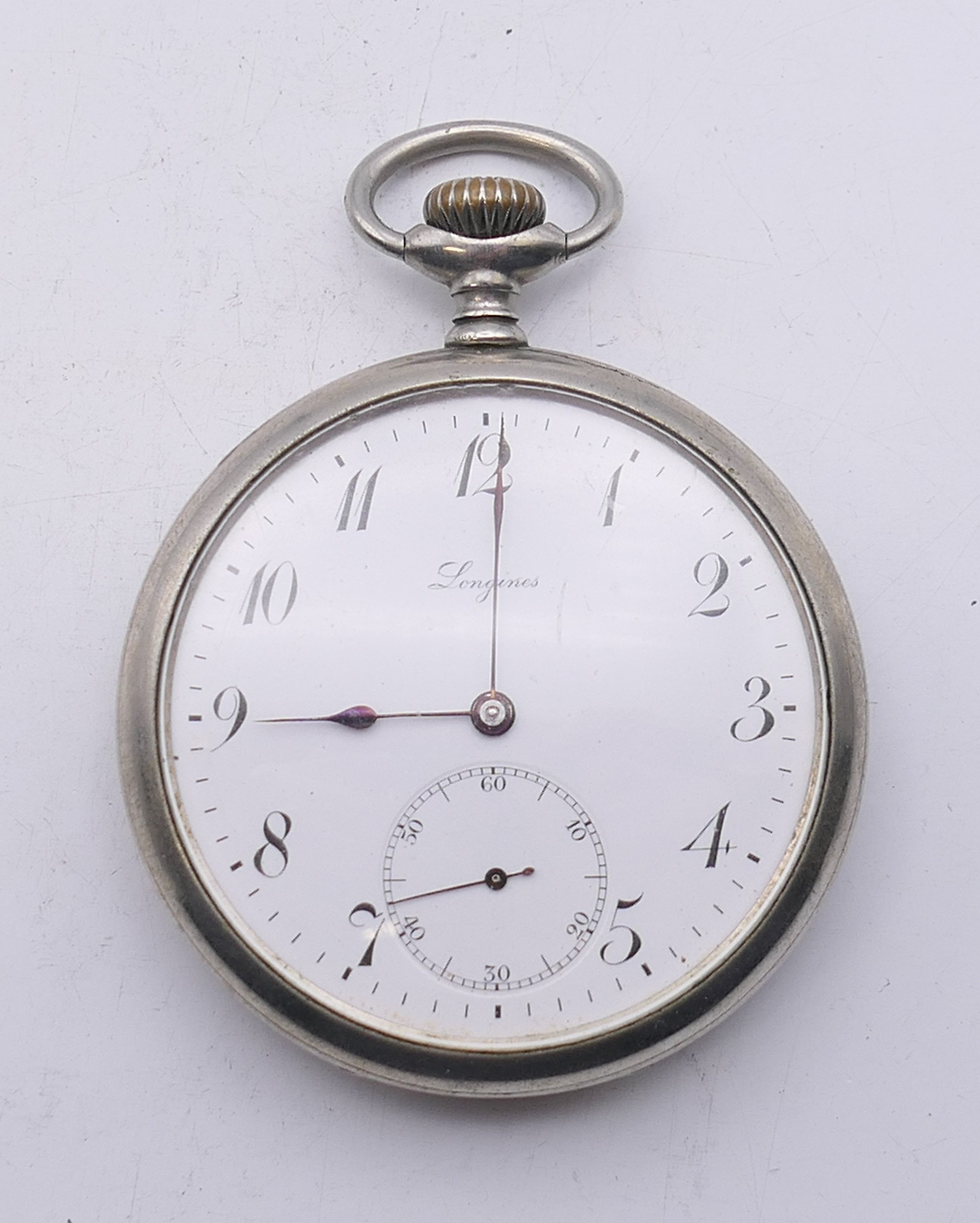 A Longines gentleman's pocket watch. 5 cm diameter.