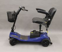 An battery-operated mobility scooter in working order. 103 cm long.