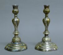 A pair of silver-plated candlesticks. 23 cm high.