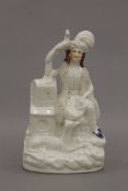 A 19th century Staffordshire pottery male figure in plumed hat, seated on a low wall,