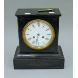 A Victorian black slate mantle clock. 28 cm high.