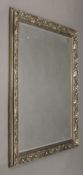 A large mirror with silvered frame. 102 x 133 cm overall.