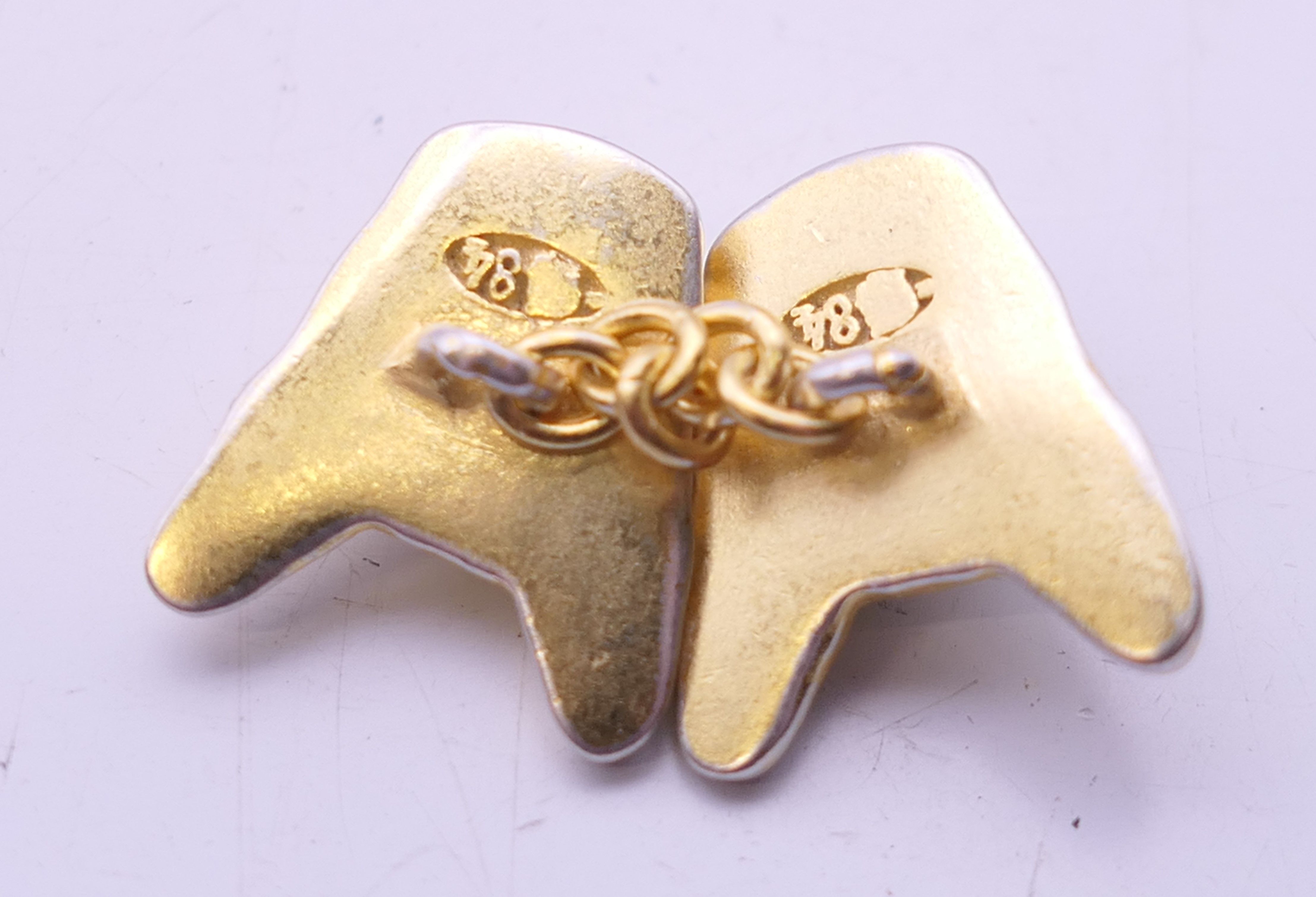 A pair of silver gilt cufflinks formed as French bulldog heads bearing Russian marks. 1.5 cm high. - Image 3 of 3
