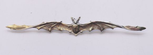 A silver bat brooch. 11.5 cm wide.