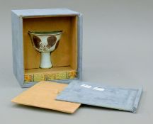 A boxed Chinese porcelain stem cup. The cup 10 cm high.