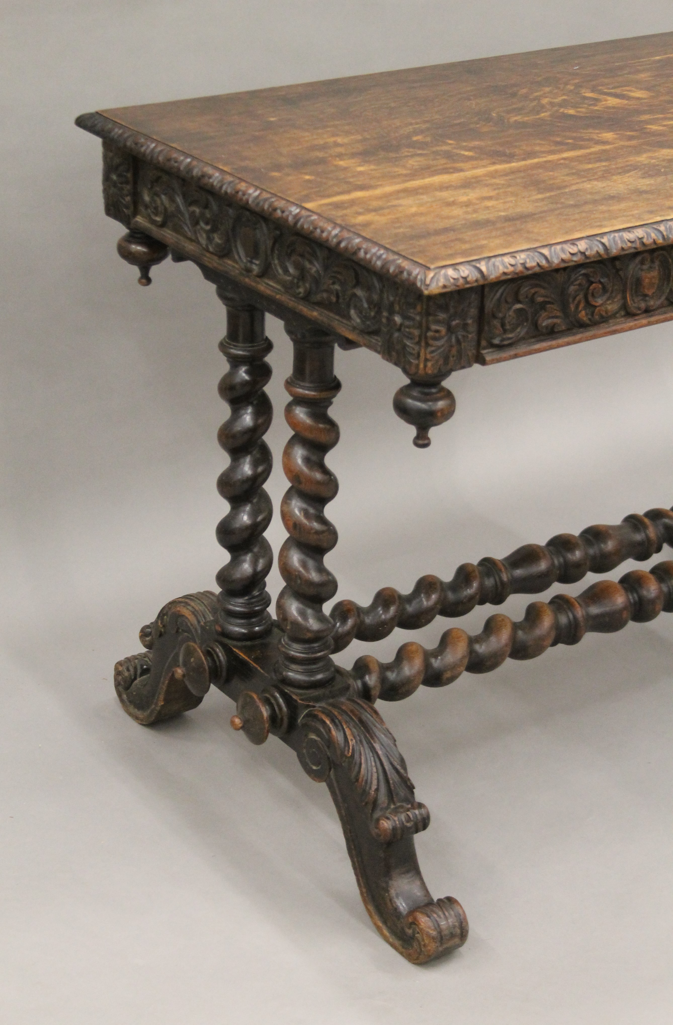 A Victorian carved oak barley twist two drawer writing table. 105 cm long. - Image 3 of 9