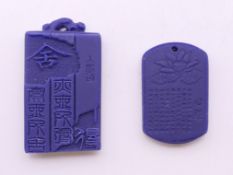 Two Chinese pendants. The largest 5 cm high.