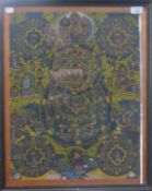 A painted antique Tibetan Buddhist painting (thanka) of deities, animals, reptiles etc.