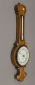 A Victorian oak cased banjo barometer. 82 cm high.