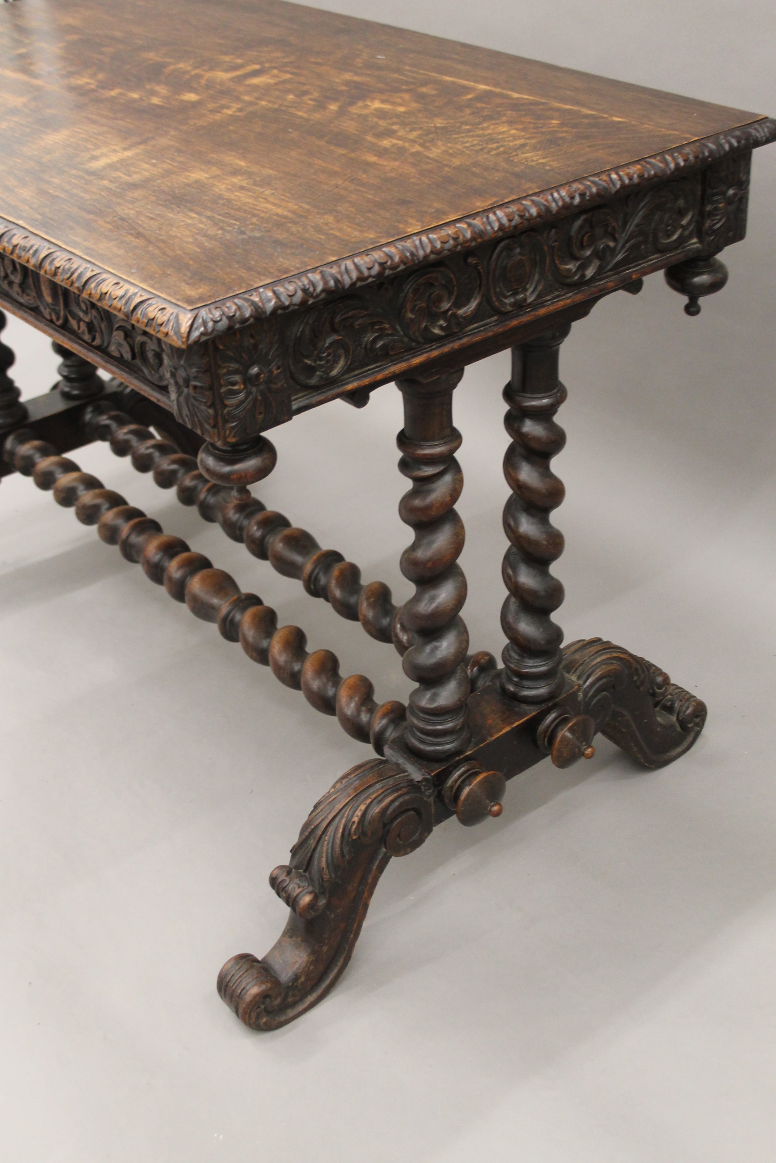 A Victorian carved oak barley twist two drawer writing table. 105 cm long. - Image 4 of 9