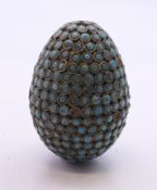 A turquoise-mounted egg form box. 6 cm high.