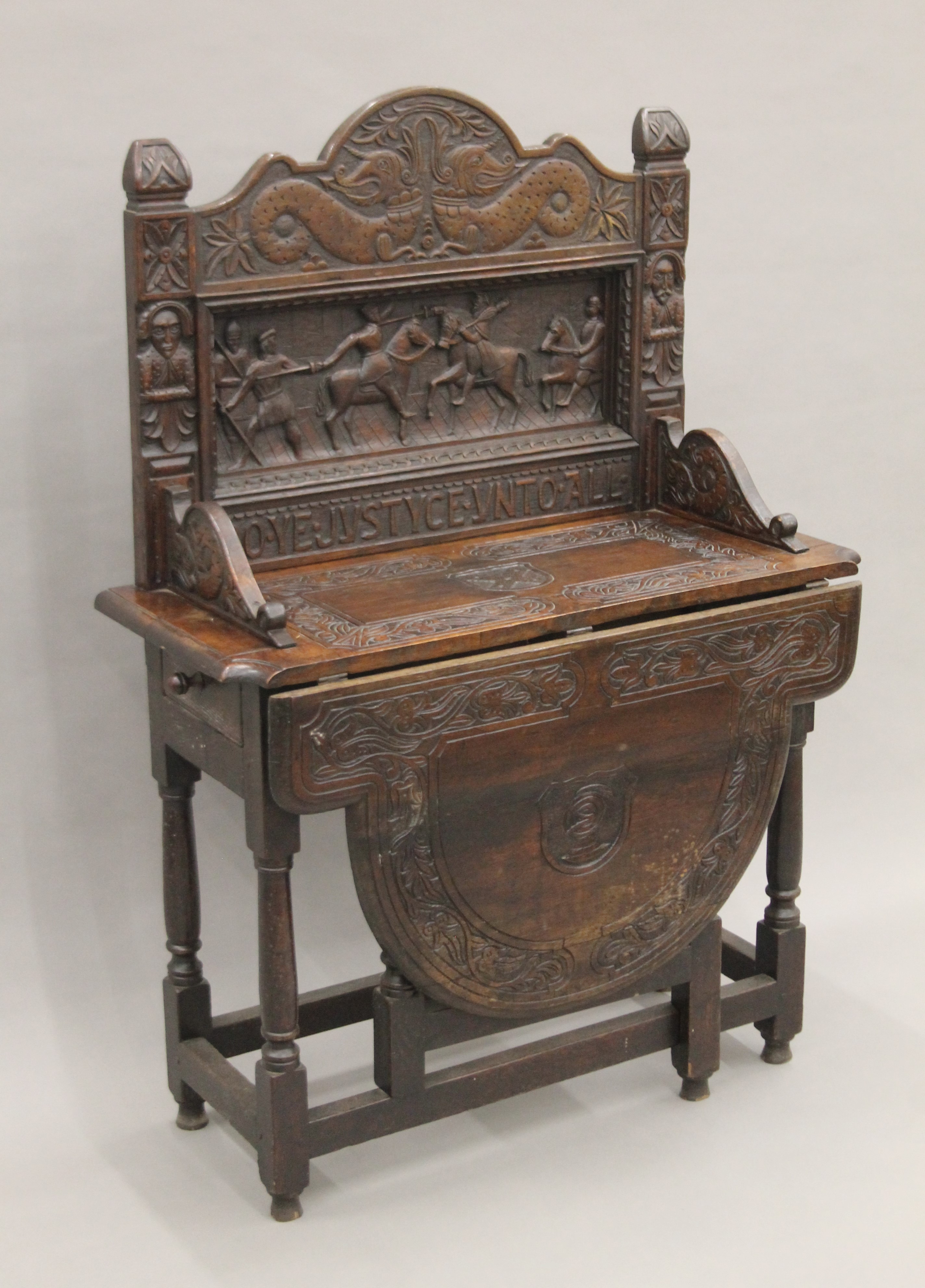 A carved oak single flap side table, the back carved with a scene titled Do Ye Justyce Unto All. - Image 2 of 8