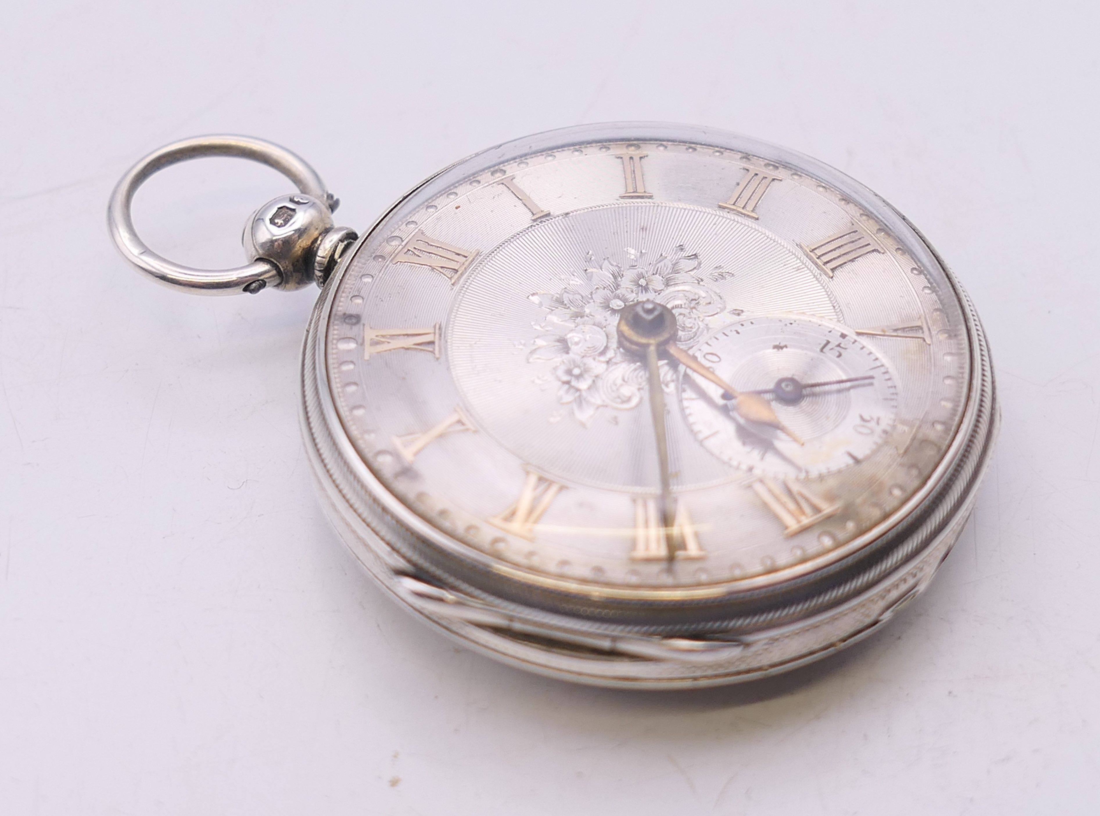 A silver pocket watch with engraved dial, hallmarked for London 1855. 4 cm diameter. - Image 2 of 6