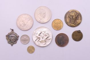 A small collection of various coins and medallions.