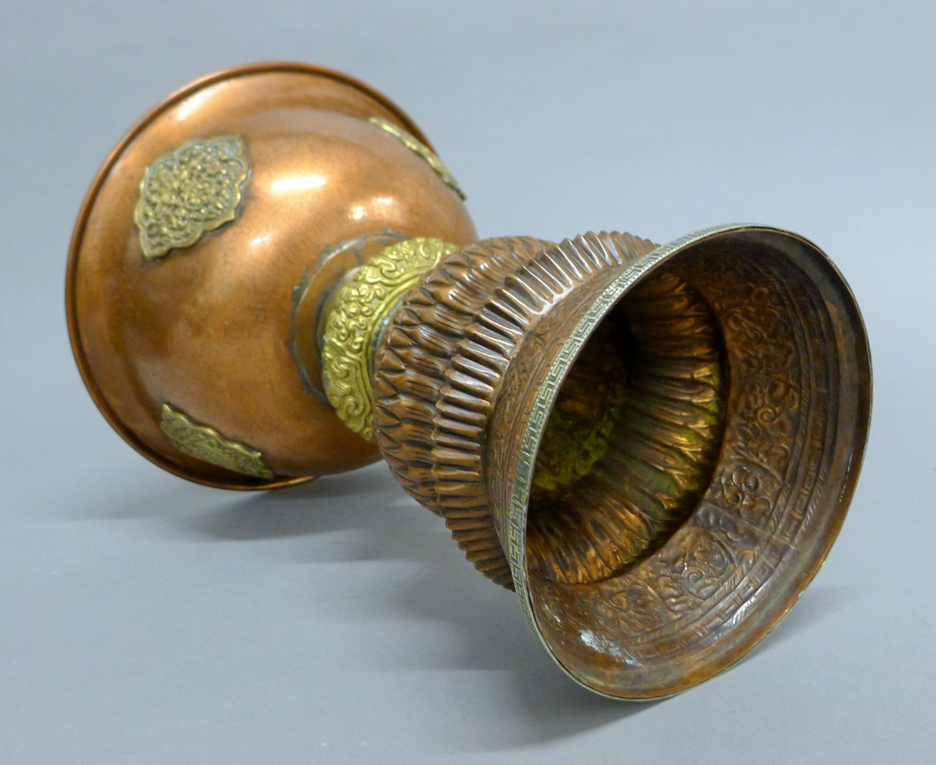 A late 19th century large Tibetan copper and brass butter lamp with silver base rim. - Image 5 of 5