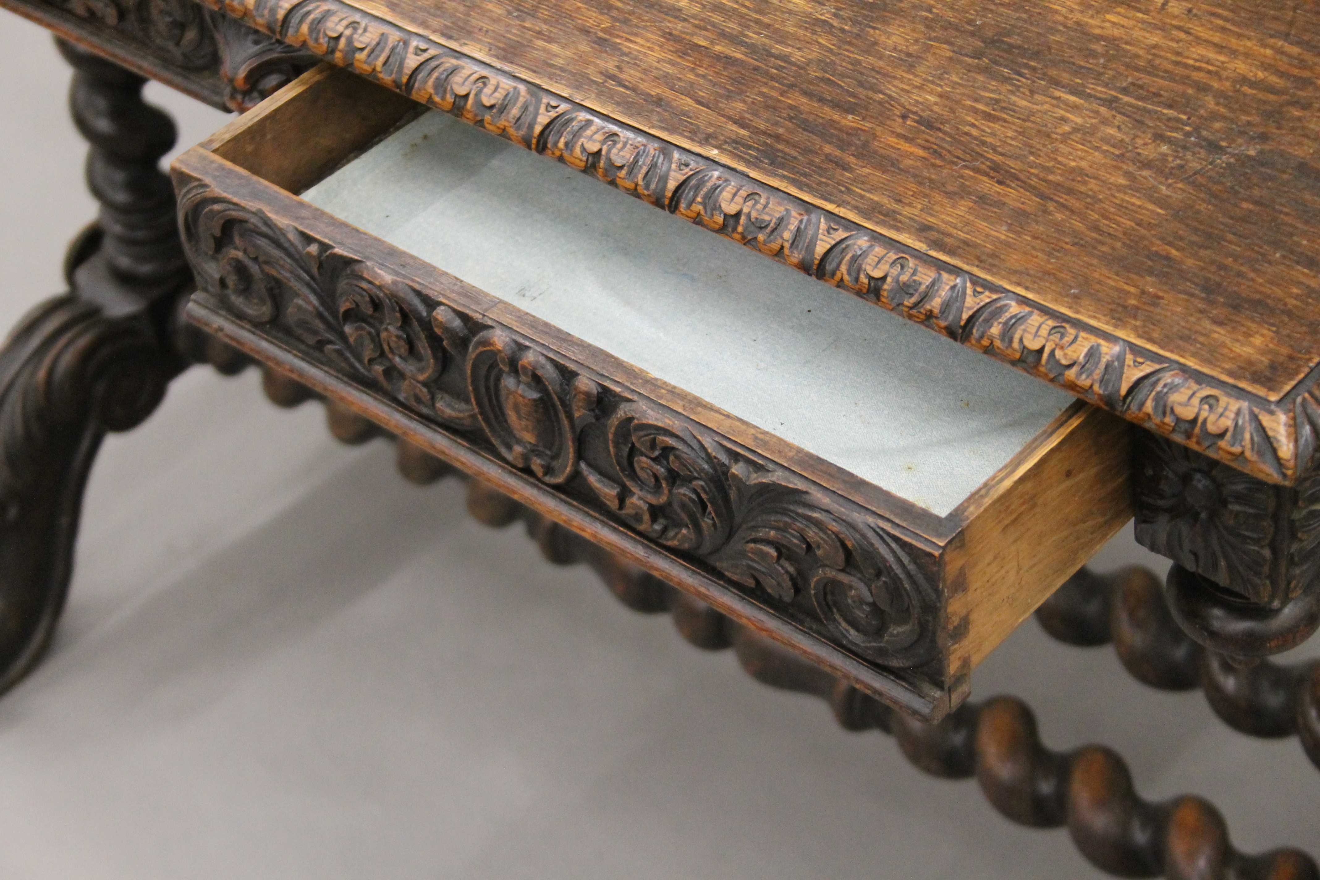 A Victorian carved oak barley twist two drawer writing table. 105 cm long. - Image 8 of 9