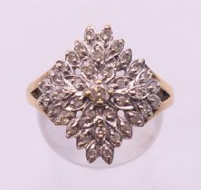 A 9 ct gold diamond cluster ring. Ring size O/P.