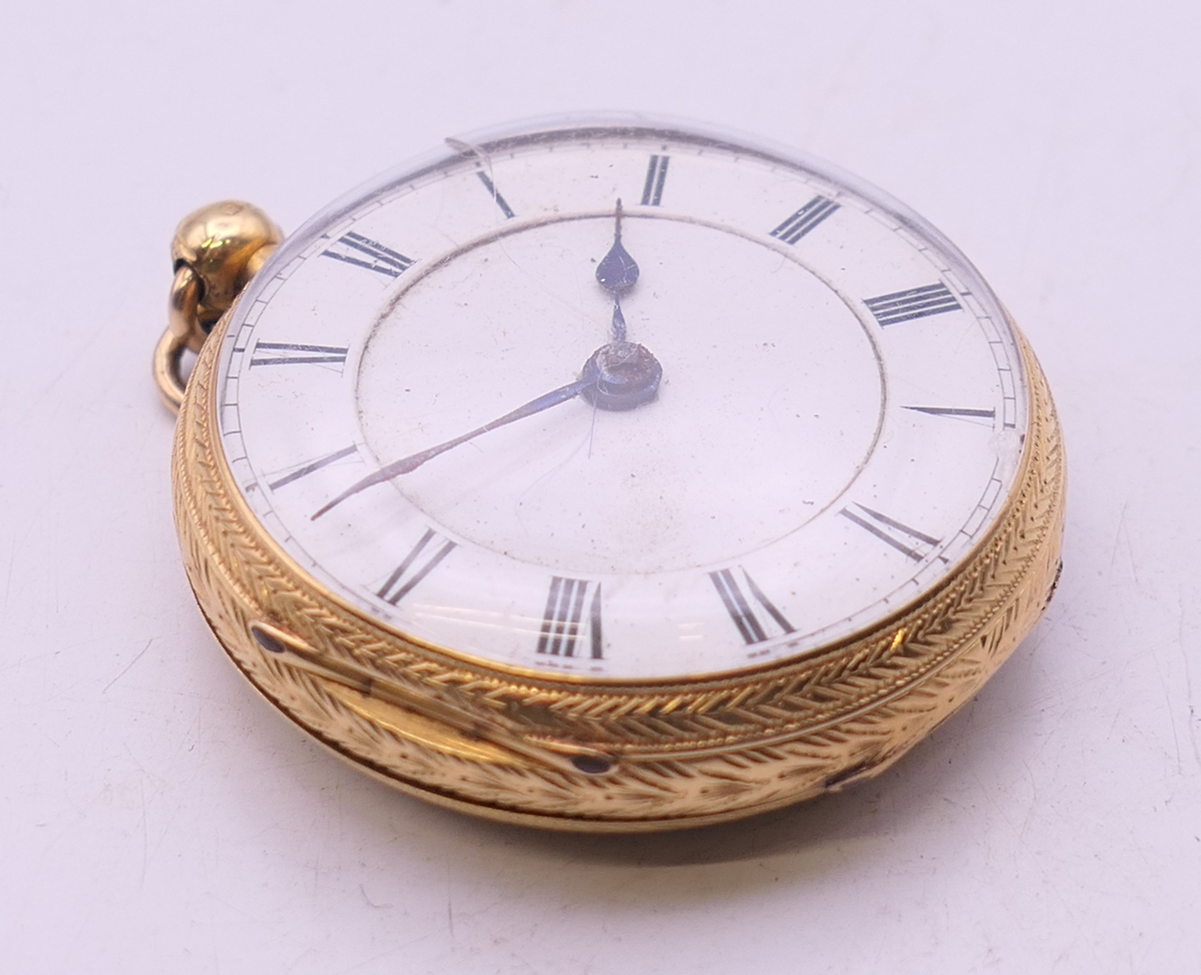 An 18 K gold open-faced pocket watch. 4 cm diameter. 61.8 grammes total weight. - Image 2 of 10