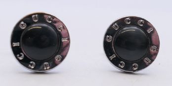 A pair of Gucci cufflinks (boxed). 2 cm diameter.