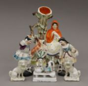 A Staffordshire flat back figurine of Red Riding Hood together with a pair of Continental porcelain