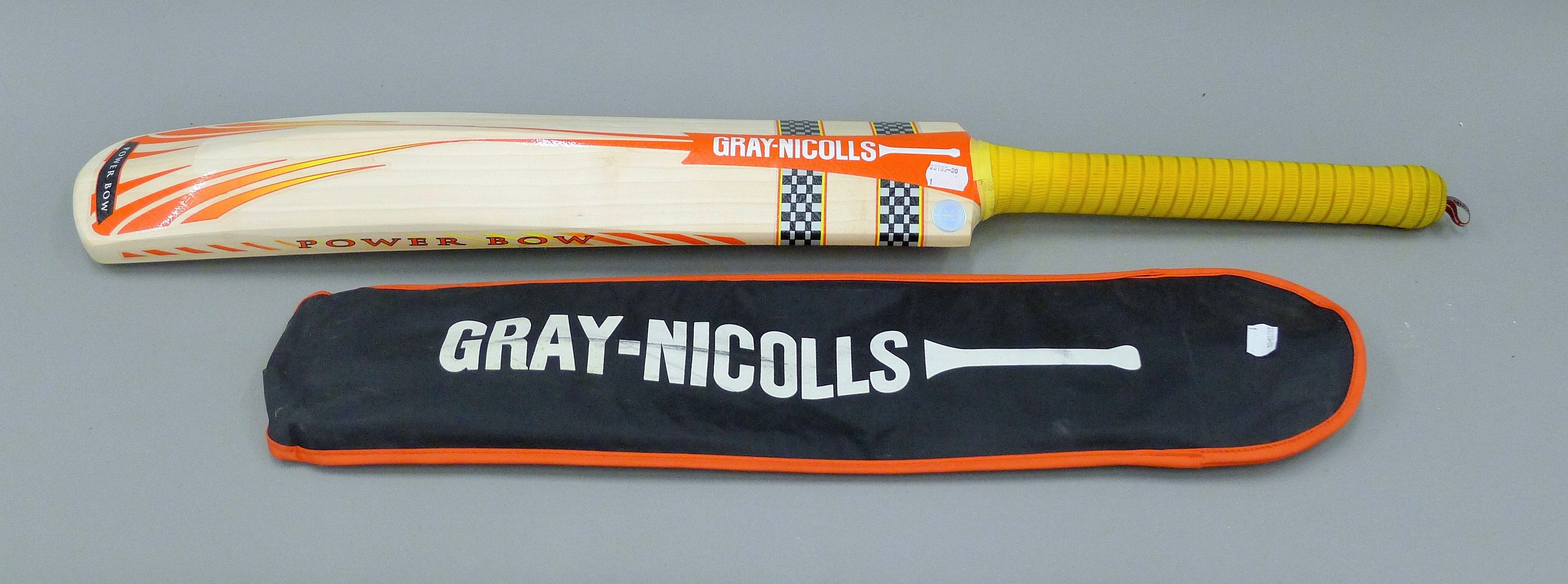 A Gray-Nicholls cricket bat with presentation inscription signed by Mike Gatting. 88 cms high.