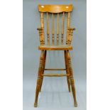 A late 19th/early 20th century child's high chair. 99 cm high.