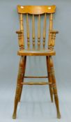 A late 19th/early 20th century child's high chair. 99 cm high.