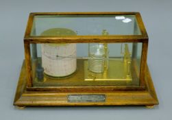 A Short & Mason of London 1950's oak barograph with applied presentation plaque 'Presented by