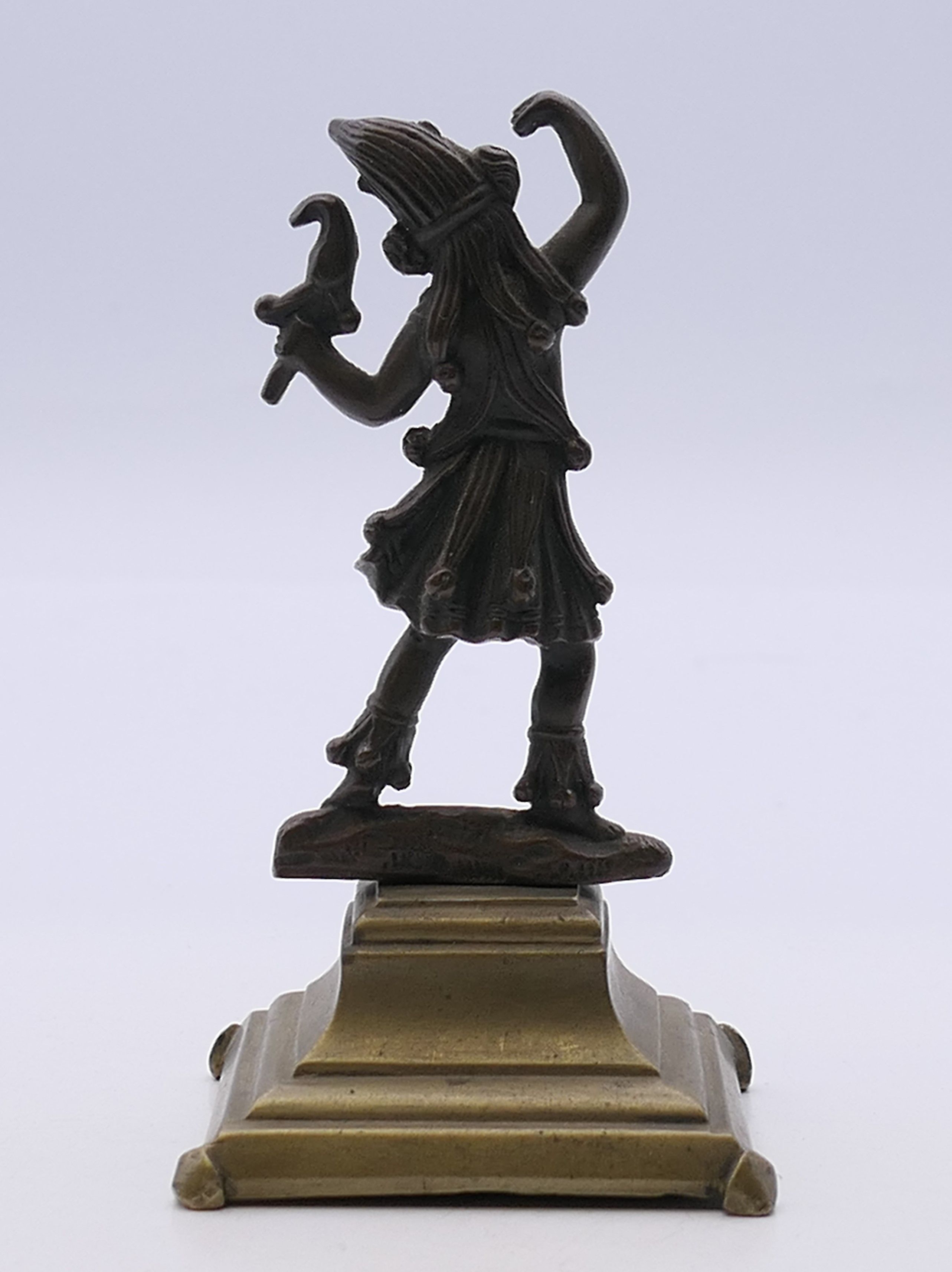 A 19th century bronze model of a jester mounted on a brass base. 10 cm high. - Image 3 of 3