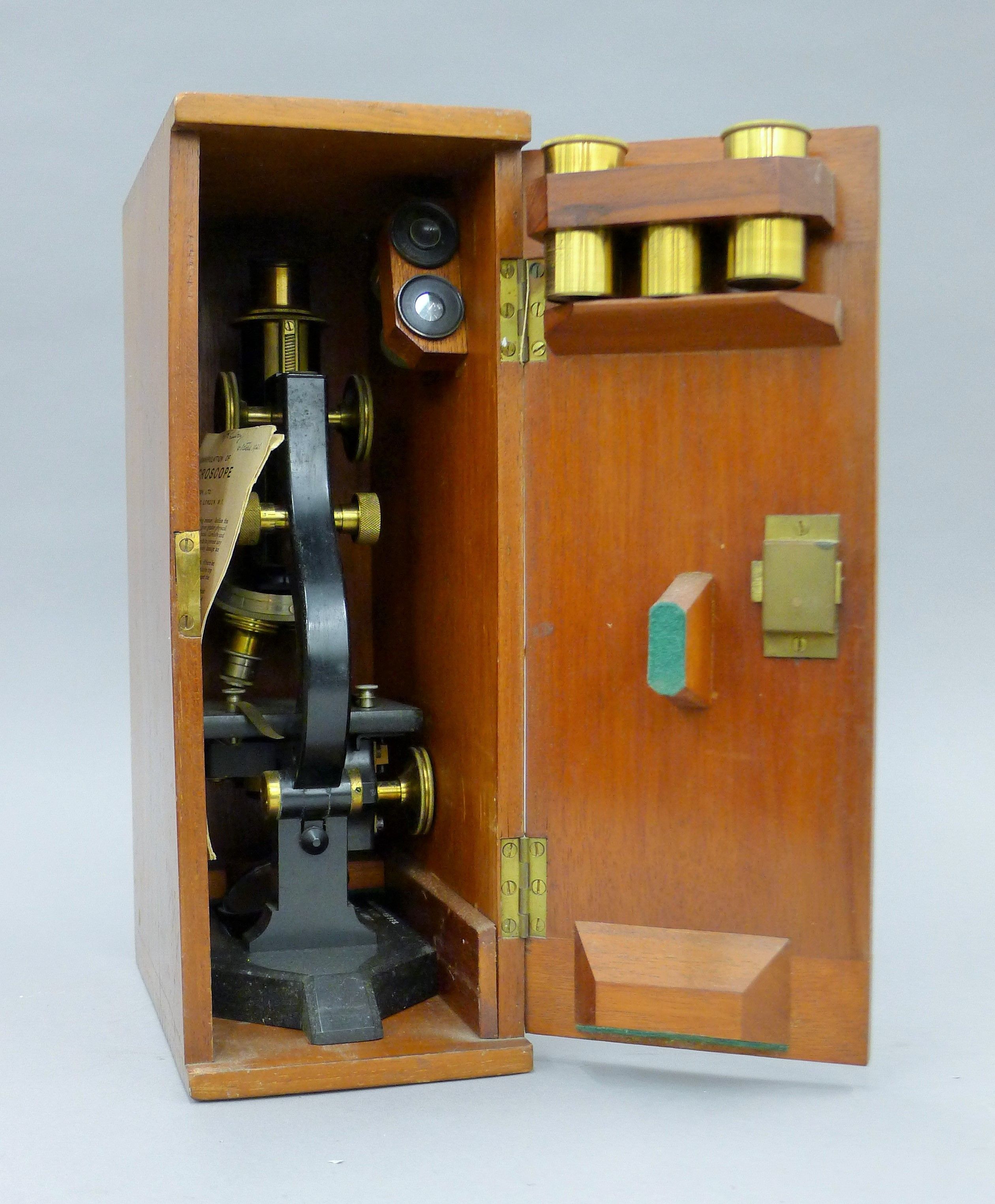 A 1920's mahogany-cased microscope marked for J Swift & Son, London, BSG Standard 16778.
